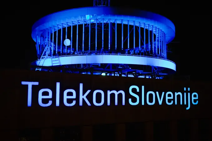 The illuminated Telekom Slovenije sign at the company headquarters